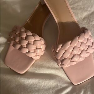 Pink, open toed, open back, braided sandal with 2 inch heel.